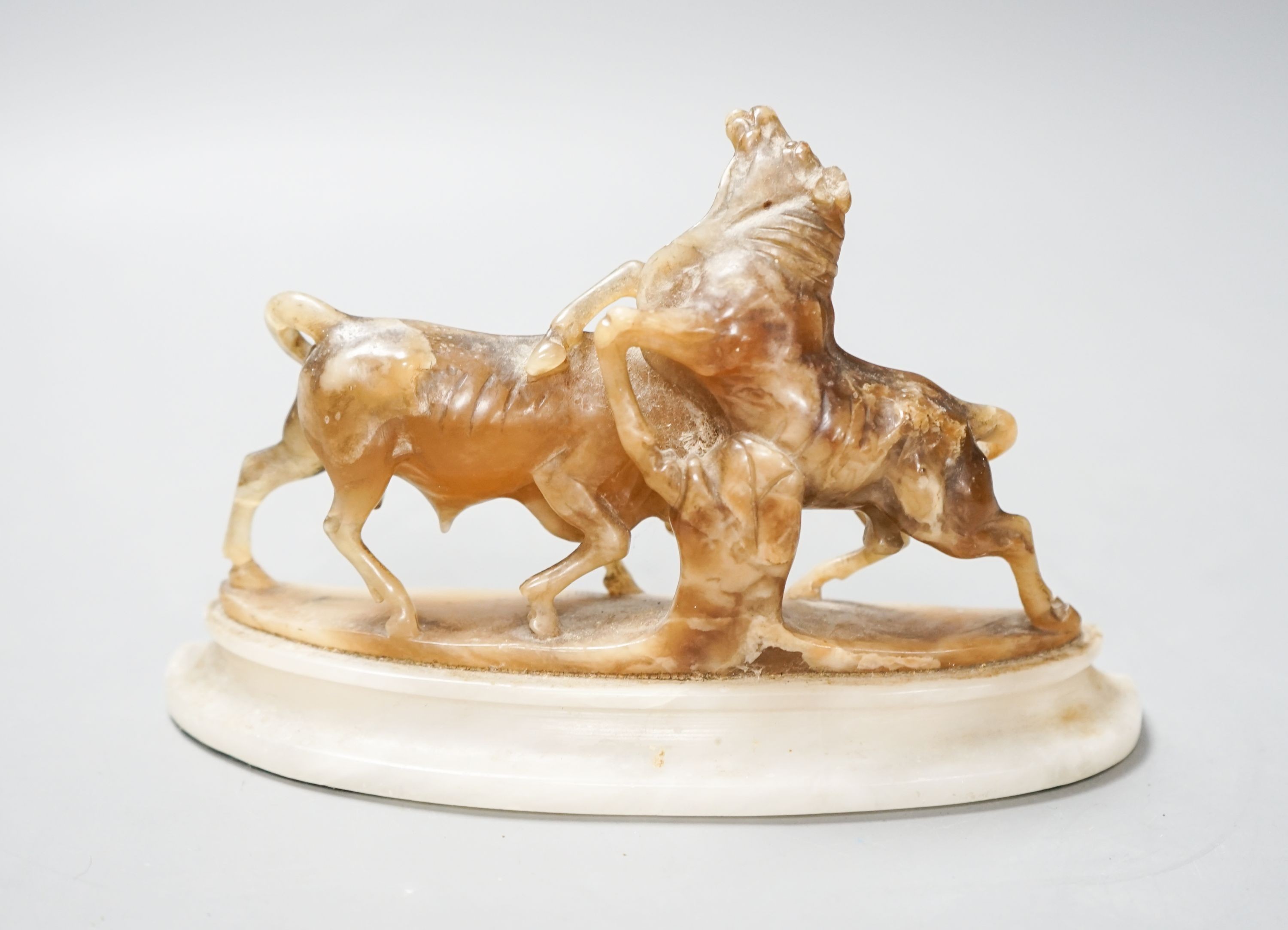 A carved soapstone bull group, 18cm